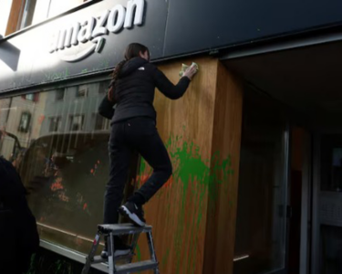 Climate Activists Spray-Paint Amazon Base at Davos