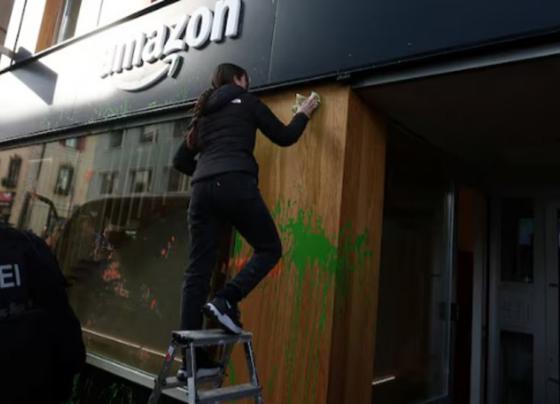 Climate Activists Spray-Paint Amazon Base at Davos